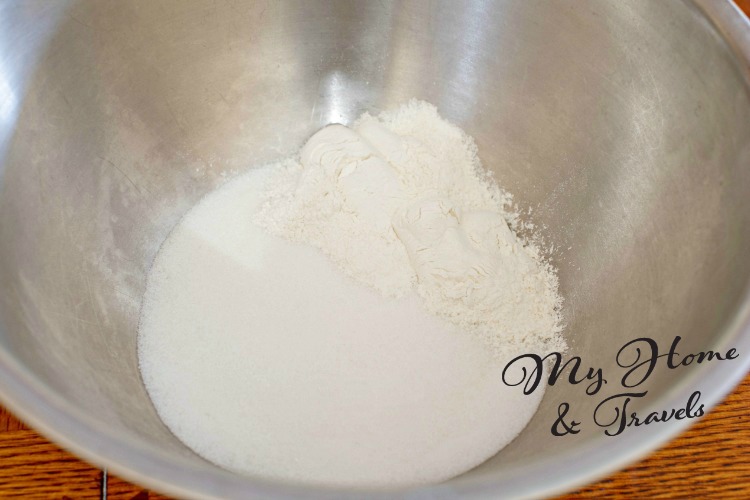 mixing together the flour and sugar 