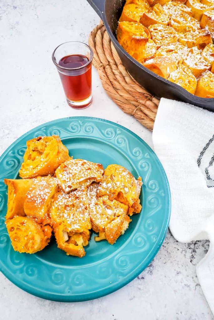 Baked Pumpkin French Toast In A Skillet served on plate