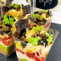 easy 7 layer dip for appetizer my home and travels dip in cups sign enjoy featured image