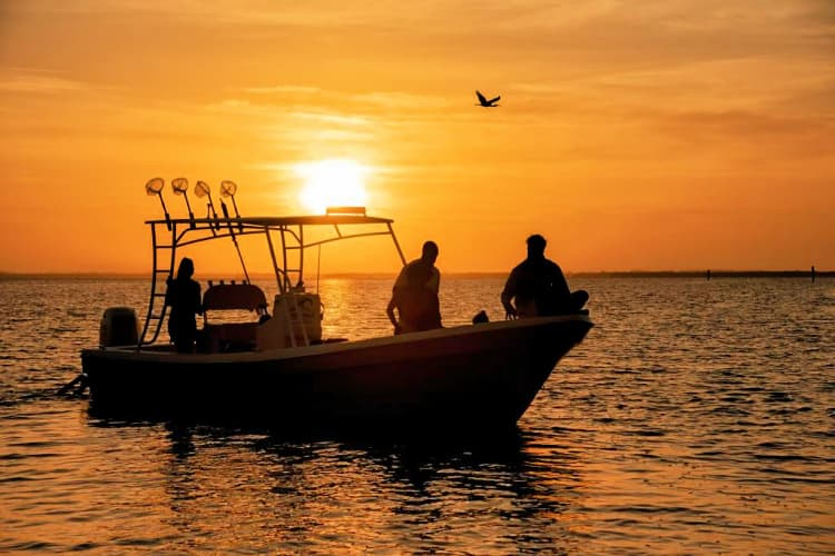 sanibel-island-boat-at-sunset-my-home-and-travels