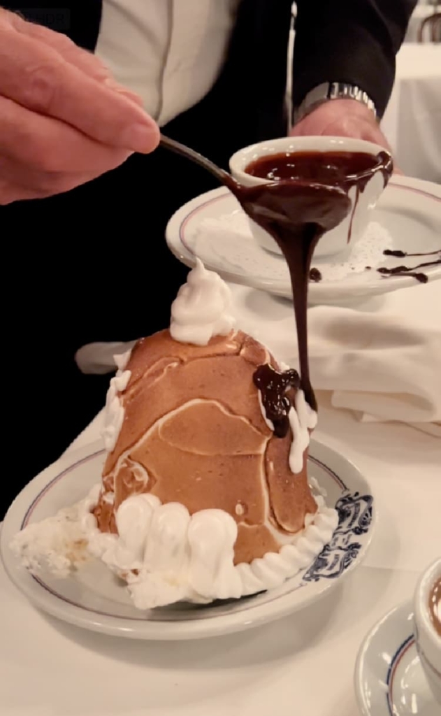 dining-at-antoines-new-orleans-my-home-and-travels-baked alaska topped with fudge sauce