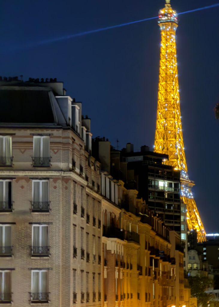 family-photo-shoot-in-paris-at-the-eiffel-tower-sparkle at night from our hotel room